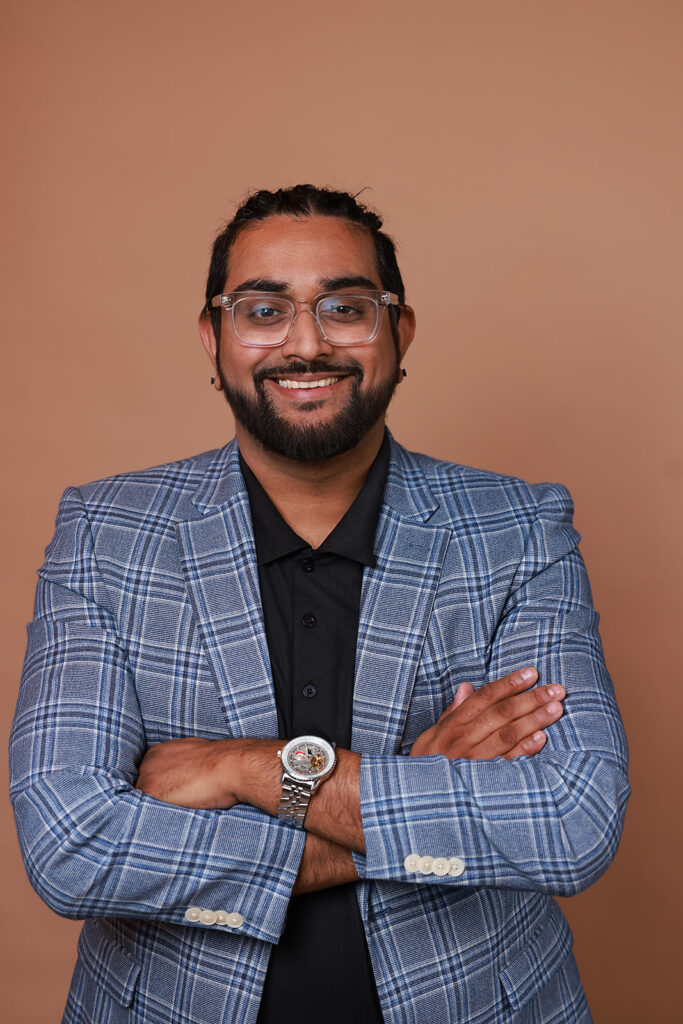 headshot of a man on a mocha backdrop