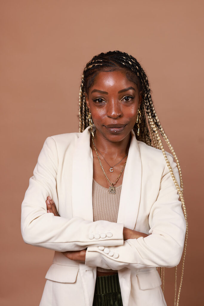 headshot of a women on a mocha backdrop