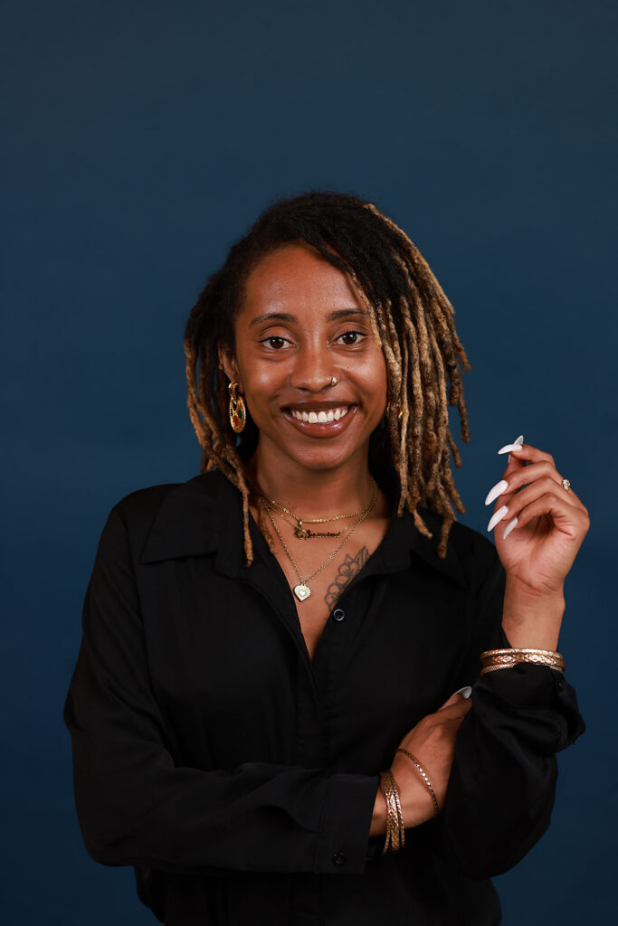 headshot of a women on a navy backdrop