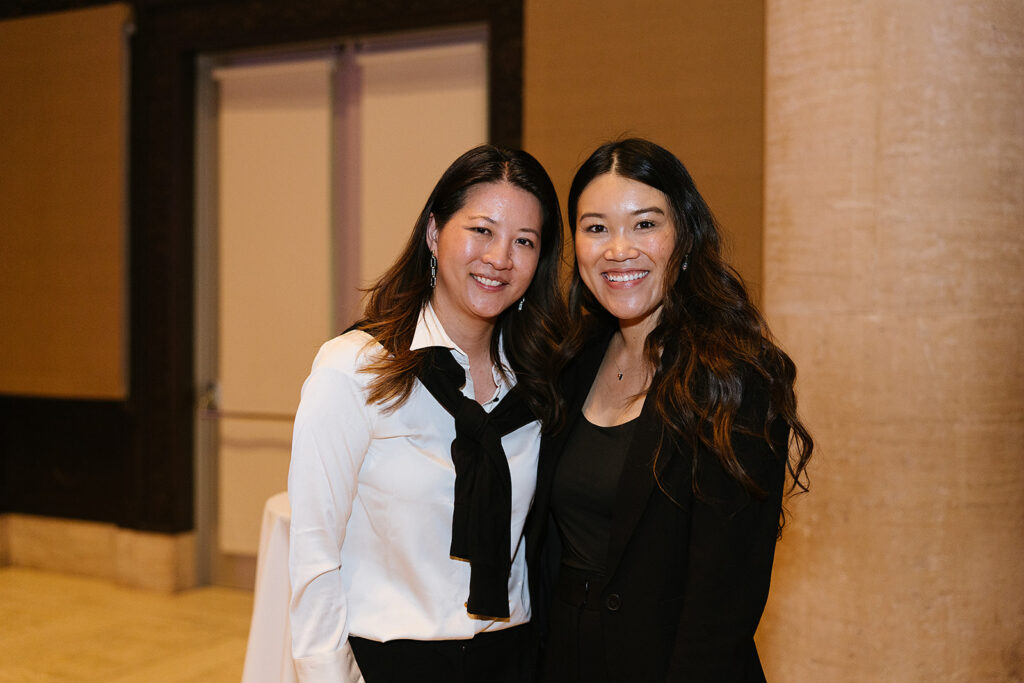 2 women looking and smiling