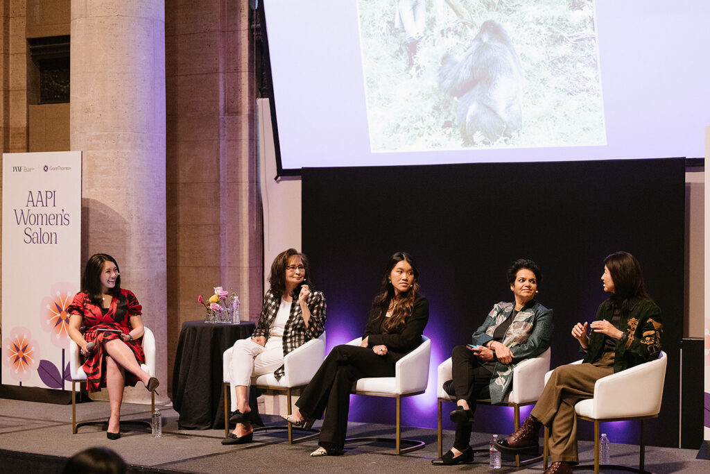 5 women on stage sitting down having a panel discussion